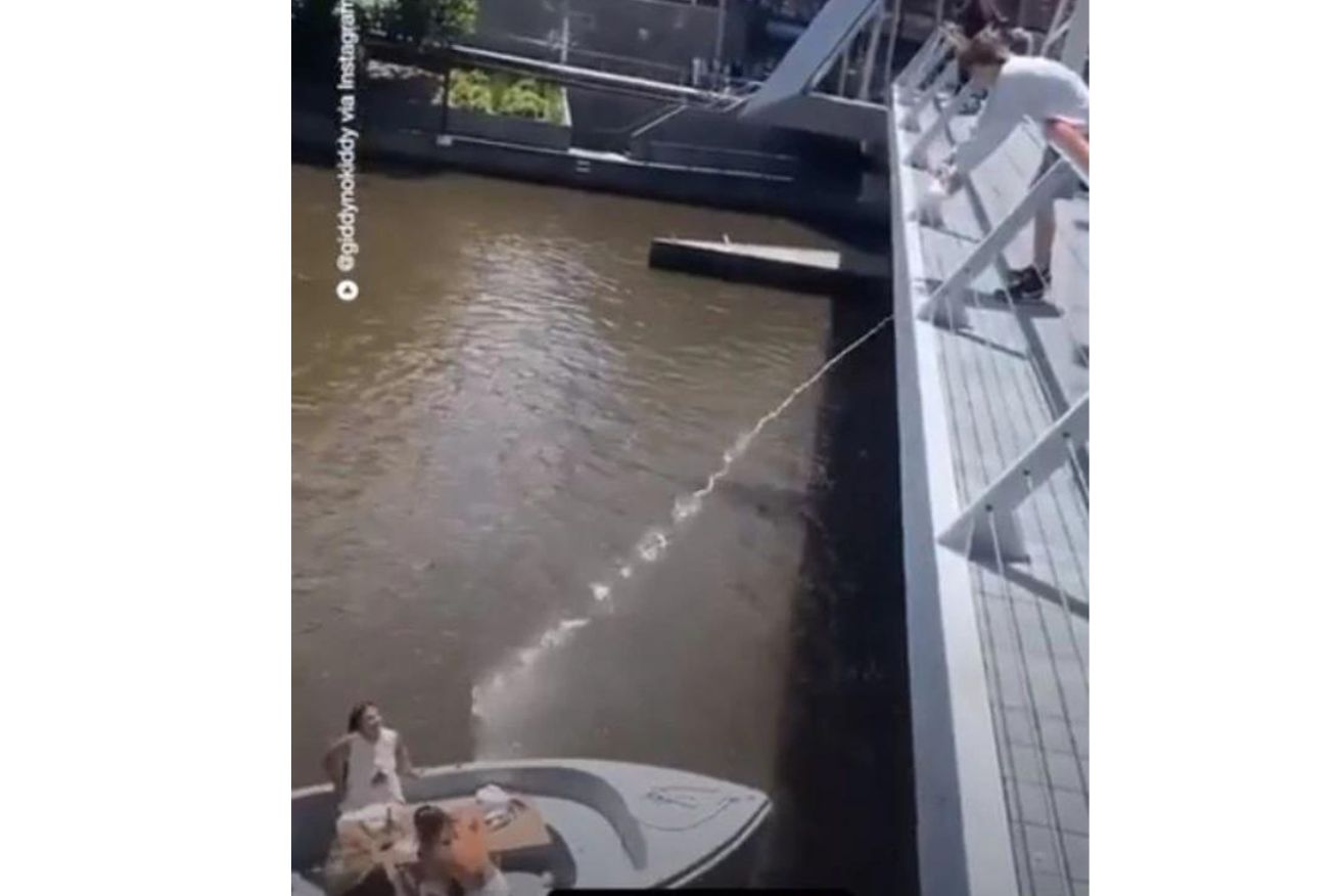 A schoolboy made headlines after being filmed on a footbridge pouring a whole bottle of milk on women enjoying a boat ride on Melbourne’s Yarra River.