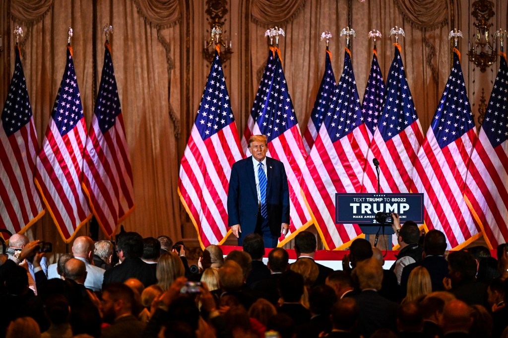 Former US President and 2024 presidential hopeful Donald Trump stands on stage during a Super Tuesday election night watch party at Mar-a-Lago Club in Palm Beach, Florida