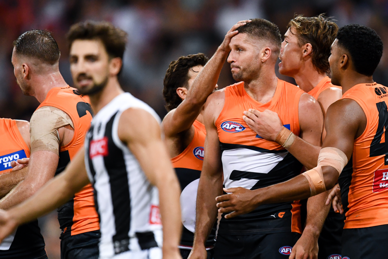 The Giants' Jesse Hogan gets a pat on the back after helping to seal the Magpies fate.