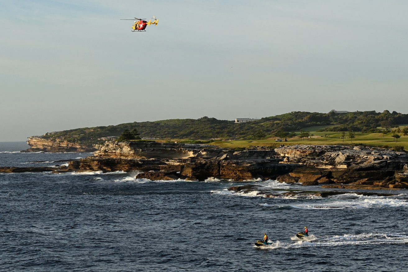 Jet skis, rescue boats and a helicopter are searching for a swimmer missing in waters off Sydney.
