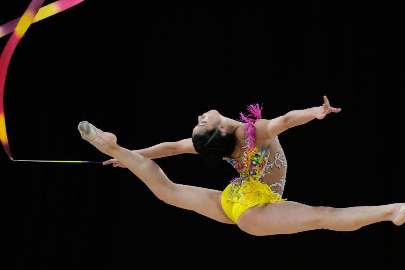 NG Joe Ee of Malaysia performs with the ribbon in the Apparatus final of the Rhythmic Gymnastics competition at the Commonwealth Games in Birmingham, England