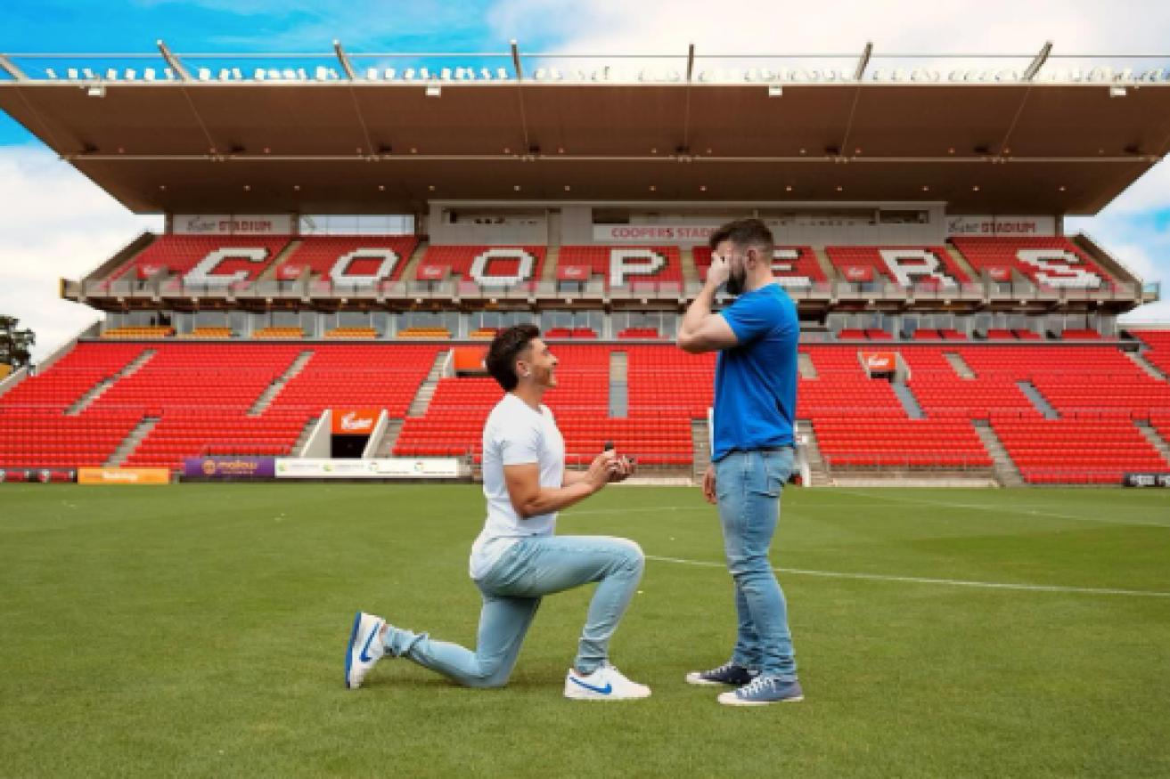 Trailblazing gay footballer Josh Cavallo has got engaged to his partner on Adelaide Utd's ground.