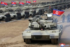 Kim Jong-un tests new tank at military exercises