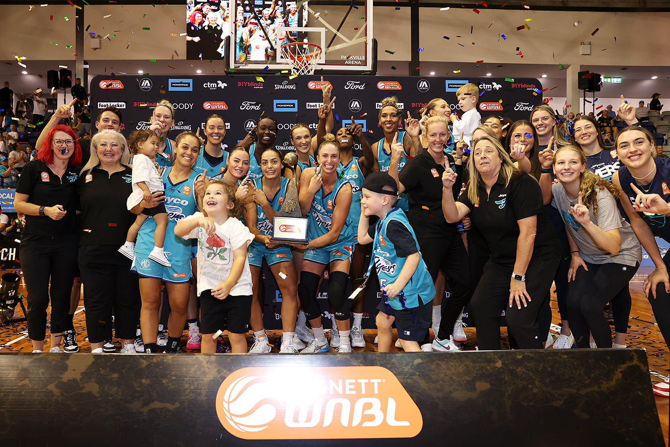 The Southside Flyers team celebrate their WNBL grand final series win over Perth Lynx on Sunday. 