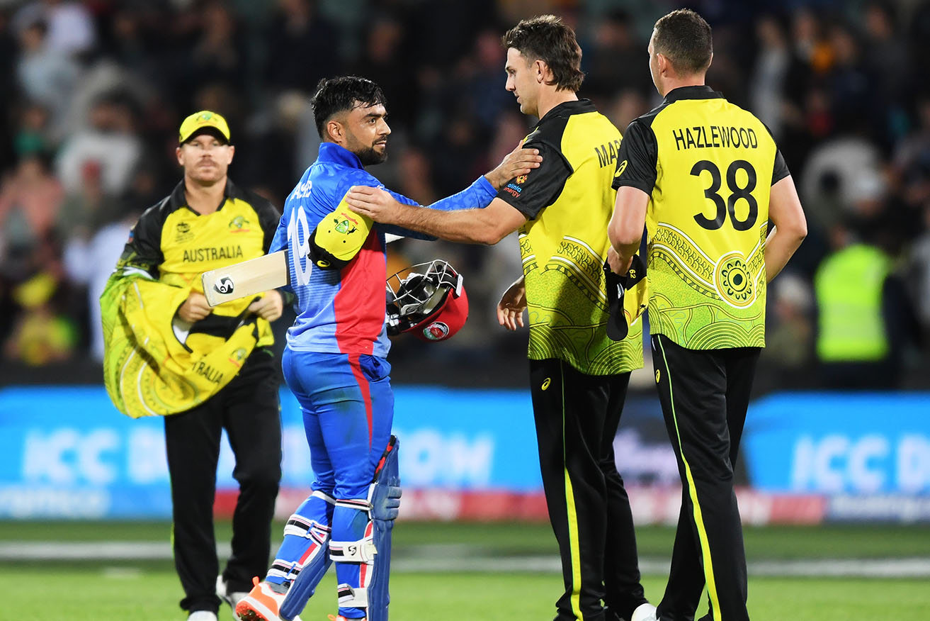 Afghanistan’s Rashid Khan chats to Mitchell Marsh and Josh Hazlewood after the ICC Men's T20 World Cup match in Adelaide in November 2022. 