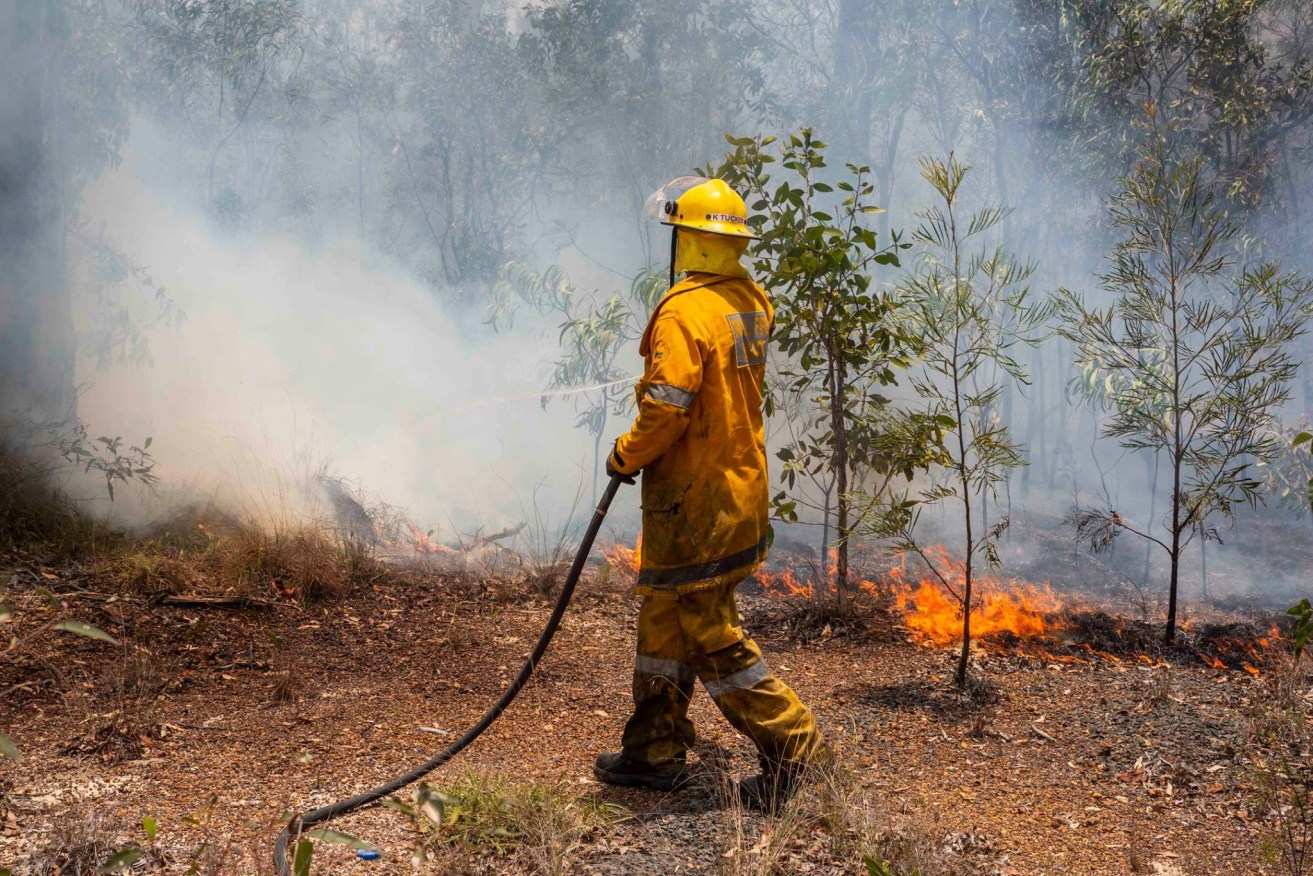 About 200 firefighters are battling a bushfire south of Perth with an emergency warning in place.