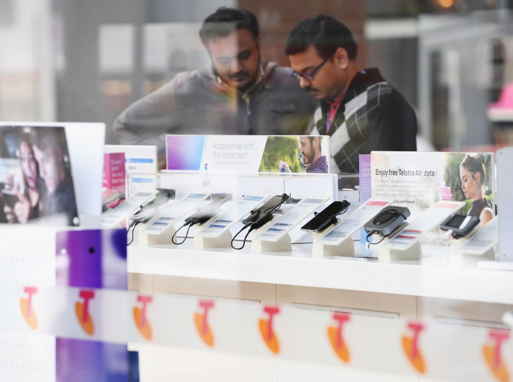 Telstra phones are seen outside the Telstra Melbourne headquarters on June 14, 2017 in Melbourne.