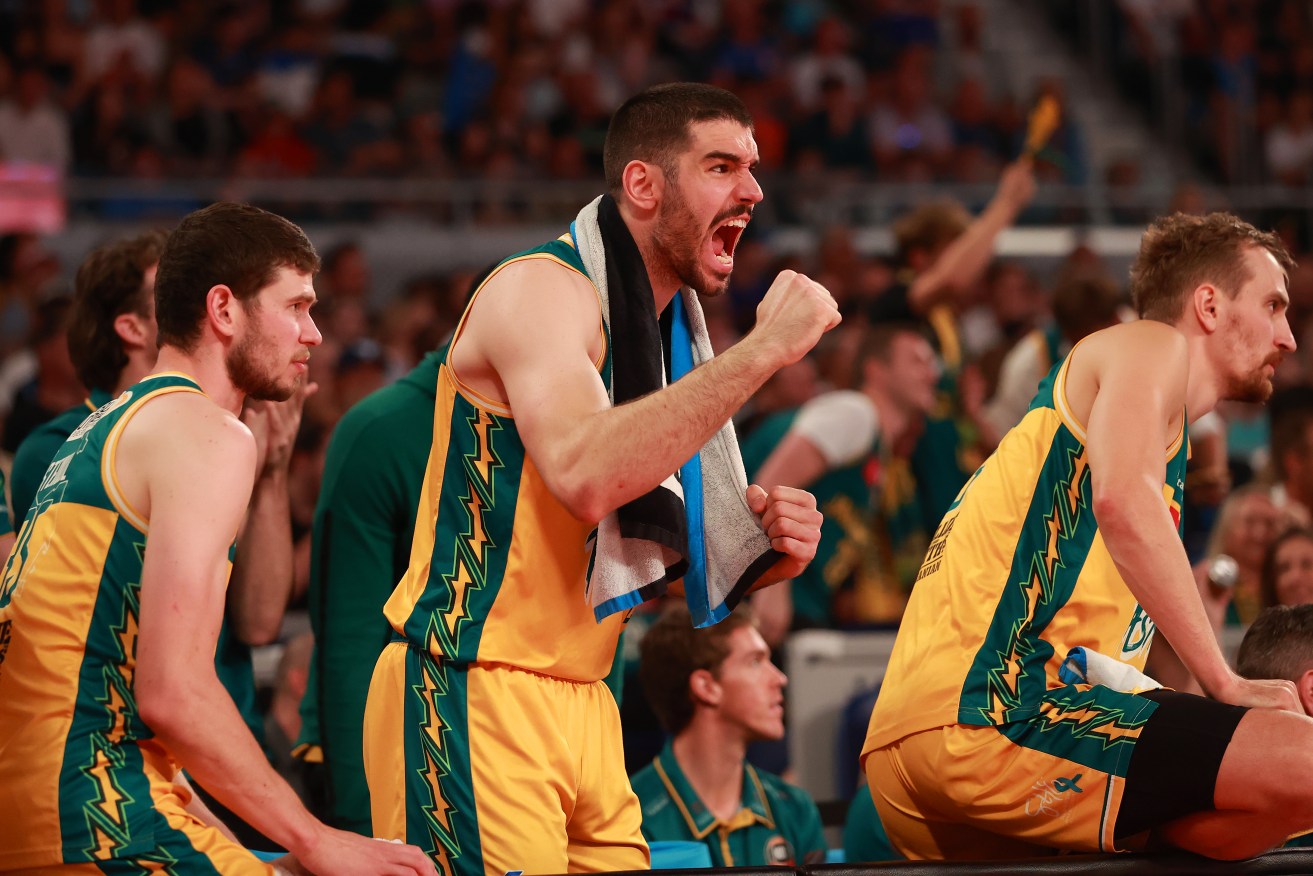 Jack Mcveigh cheers on his JackJumpers teammates during Sunday's thriller in Melbourne.  