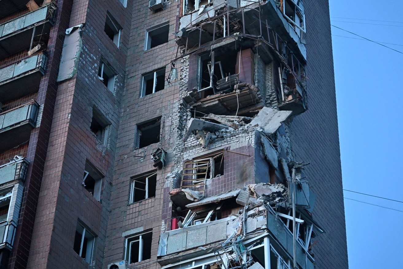 Residential buildings, stores, a medical facility and cars were damaged in the attack on Kharkiv.