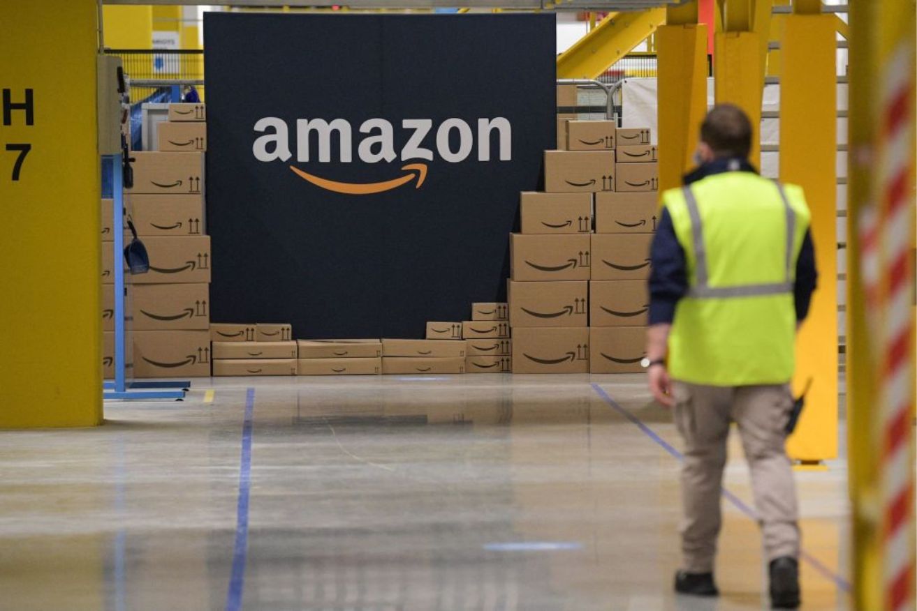 Amazon is building two mega warehouses as it looks to muscle in on brands like JB Hi-Fi and Harvey Norman.