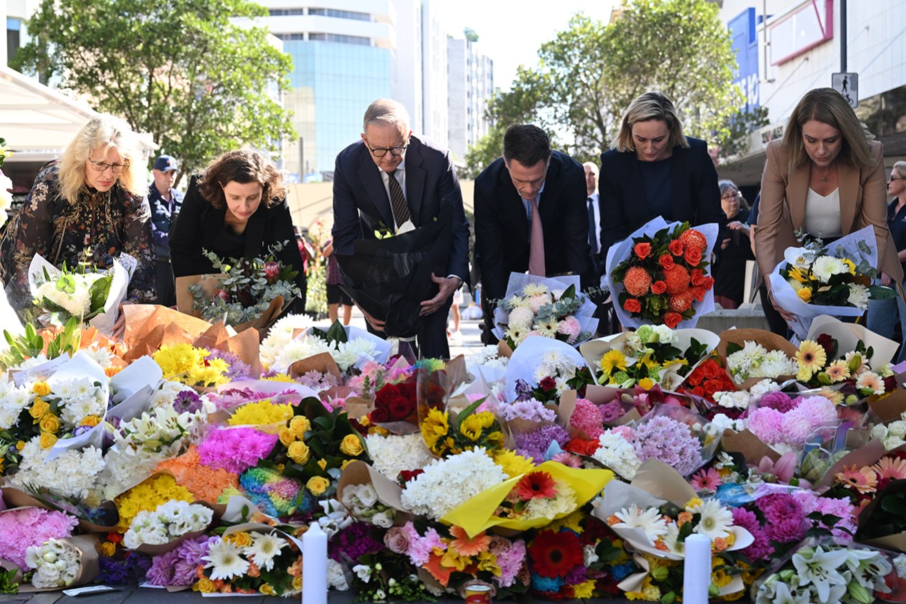 PM Anthony Albanese and NSW Premier Chris Minns lay flowers on Sunday near the scene of a mass stabbing. 