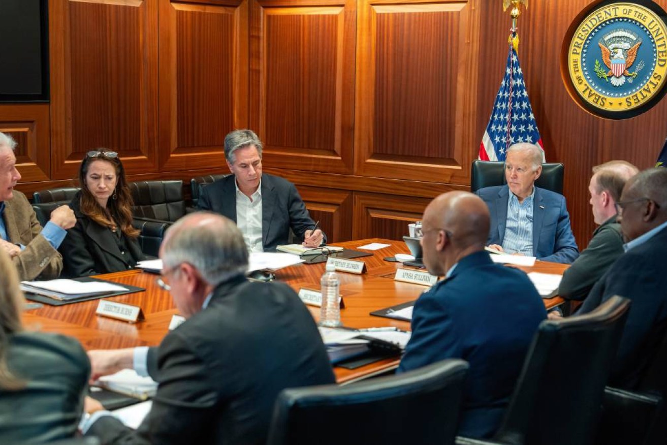 President Joe Biden, along with members of his national security team, receive an update on an ongoing airborne attack on Israel from Iran