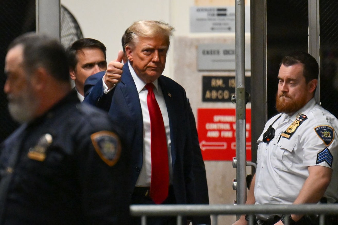 Former US President Donald Trump enters the courtroom in New York.
