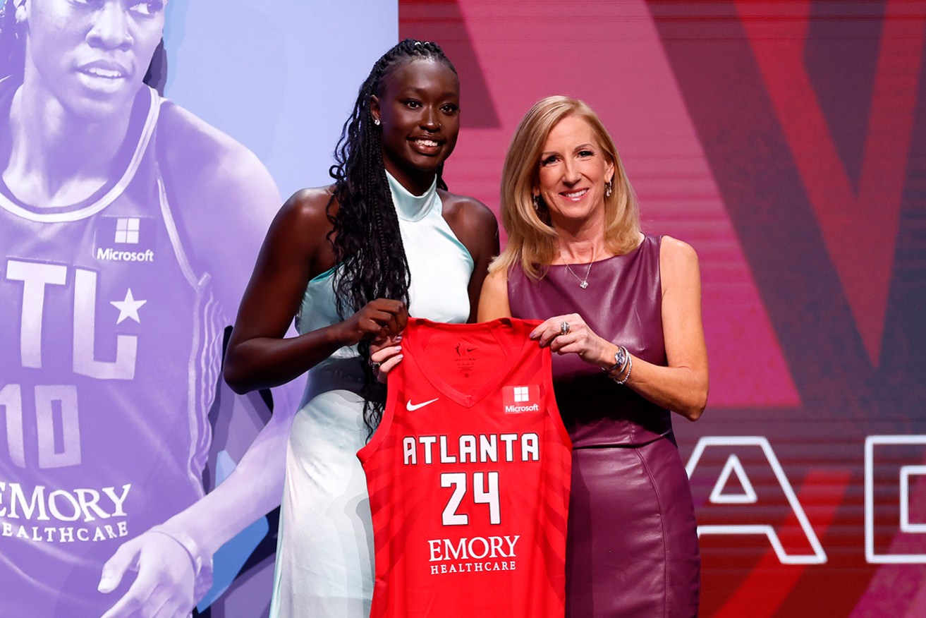 Nyadiew Puoch poses with WNBA Commissioner Cathy Engelbert after being selected 12th overall by Atlanta Dream in New York on Tuesday.