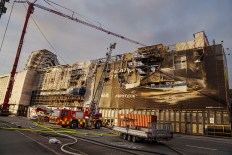 Fire reduces half of Danish building to shell