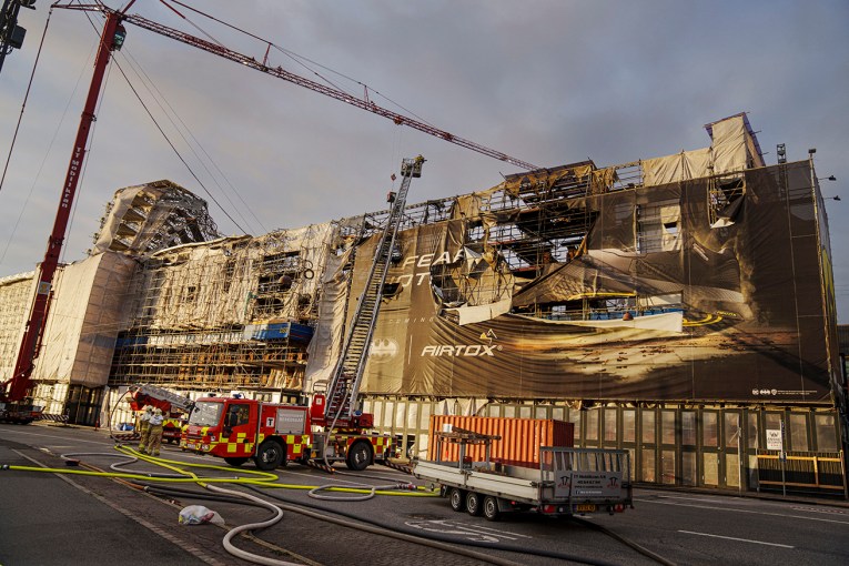 Fire reduces half of Danish building to shell