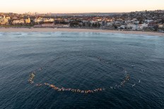 First Bondi funeral, as surfers honour victims