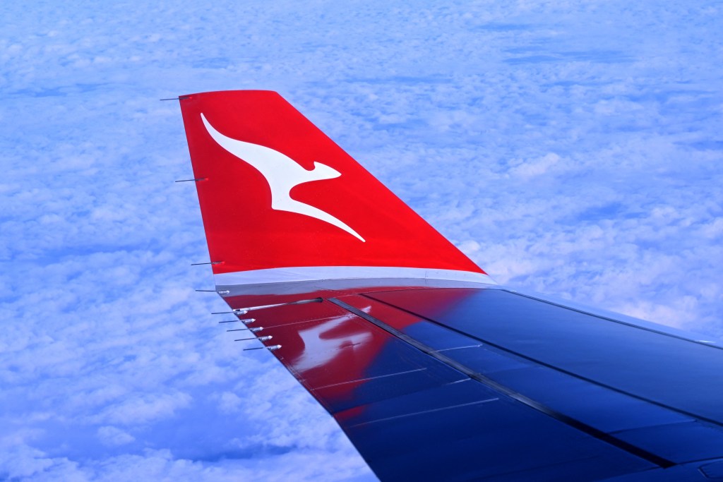 A photo taken on August 20, 2023 shows the wing-tip of a Qantas Airbus A330 descending to land at Sydney´s Kingsford Smith Airport.