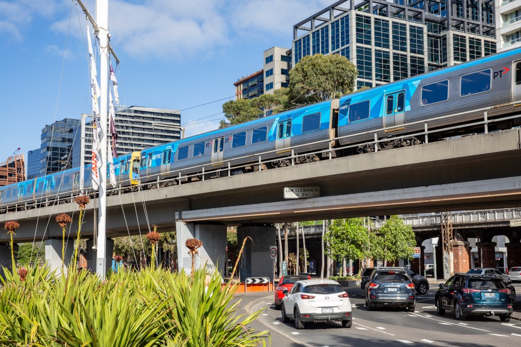 Melbourne metro train passes above commuter cars in Melbourne city centre. (Photo by: Martin Berry/Loop Images/Universal Images Group via Getty Images)