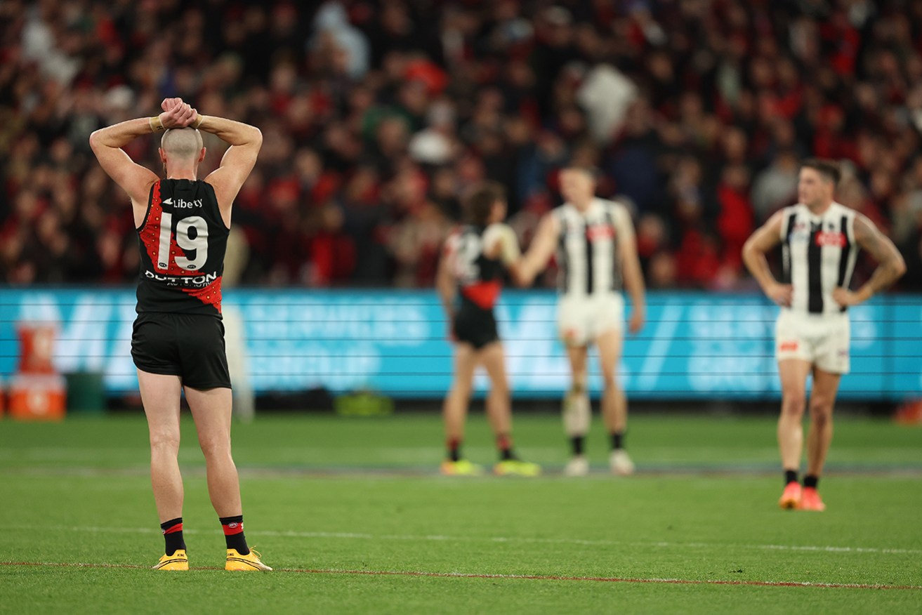 Essendon’s Nick Hind is in disbelief after the Anzac Day match against Collingwood ended in a draw.