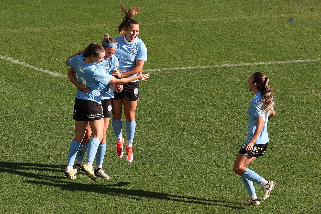 Melbourne City teammates congratulate Hannah Wilkinson after her goal on Sunday at AAMI Park. 