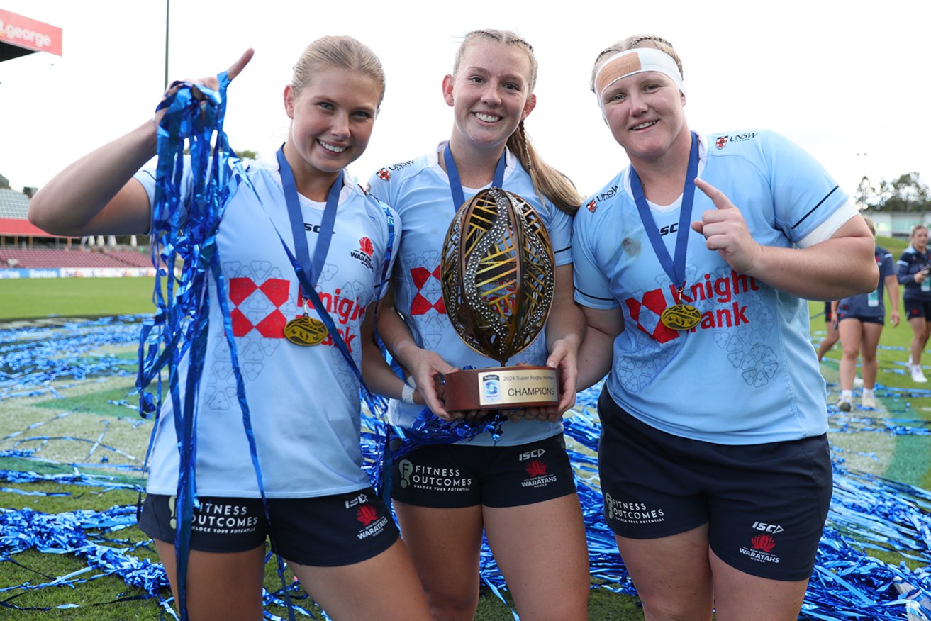 Waratahs trio Tatum Bird, Jade Sheridan and Emily Robinson enjoy their win in the Super Rugby Women's grand final at Ballymore Stadium on Sunday.