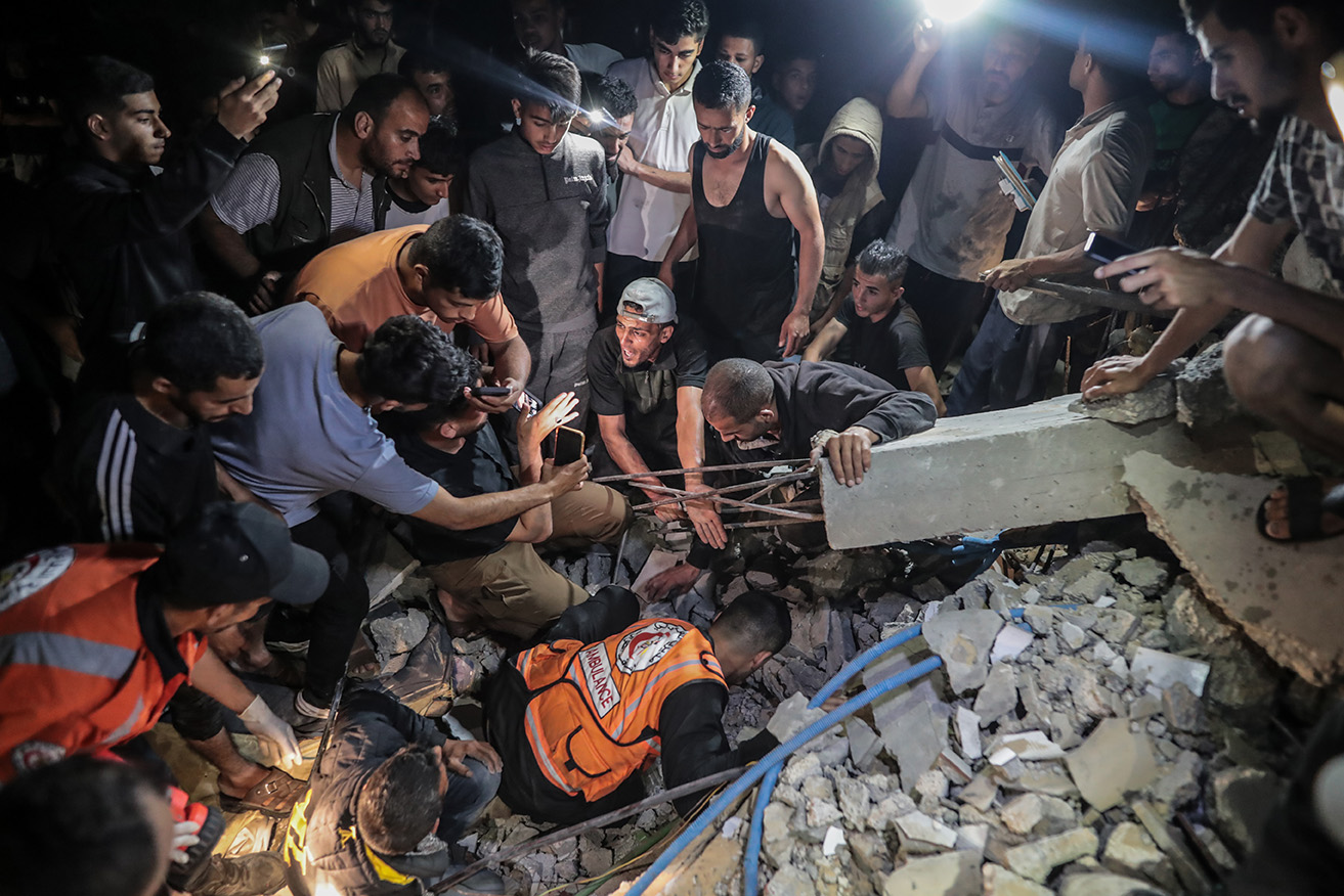 Palestinian Civil Defence teams conduct search and rescue operations in the rubble after Israeli attacks in Rafah, Gaza on Monday.