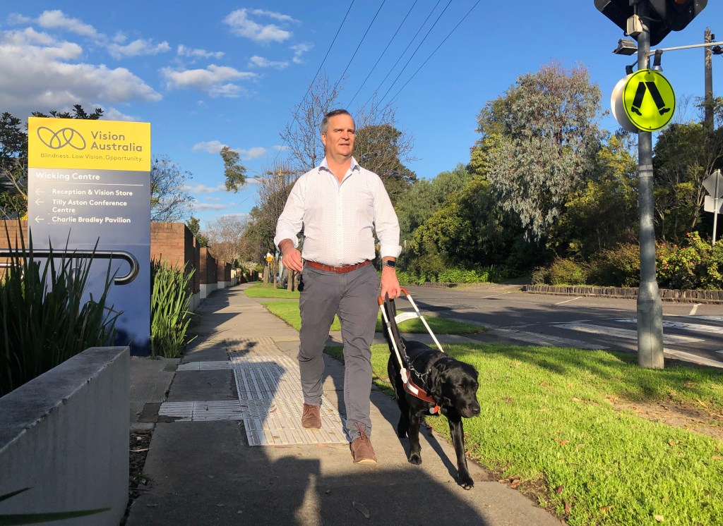 A supplied image obtained on Wednesday, April 24, 2024, of Vision Australia government relations director Chris Edwards with his guide dog in Melbourne. (AAP Image/Supplied by Vision Australia) NO ARCHIVING, EDITORIAL USE ONLY
