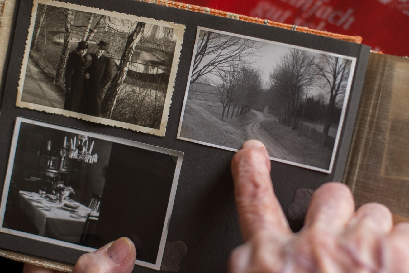 An old photo album with a picture taken prior to the WWII showing the way to the later built Fuehrer Headquarters "Wolf's Lair"