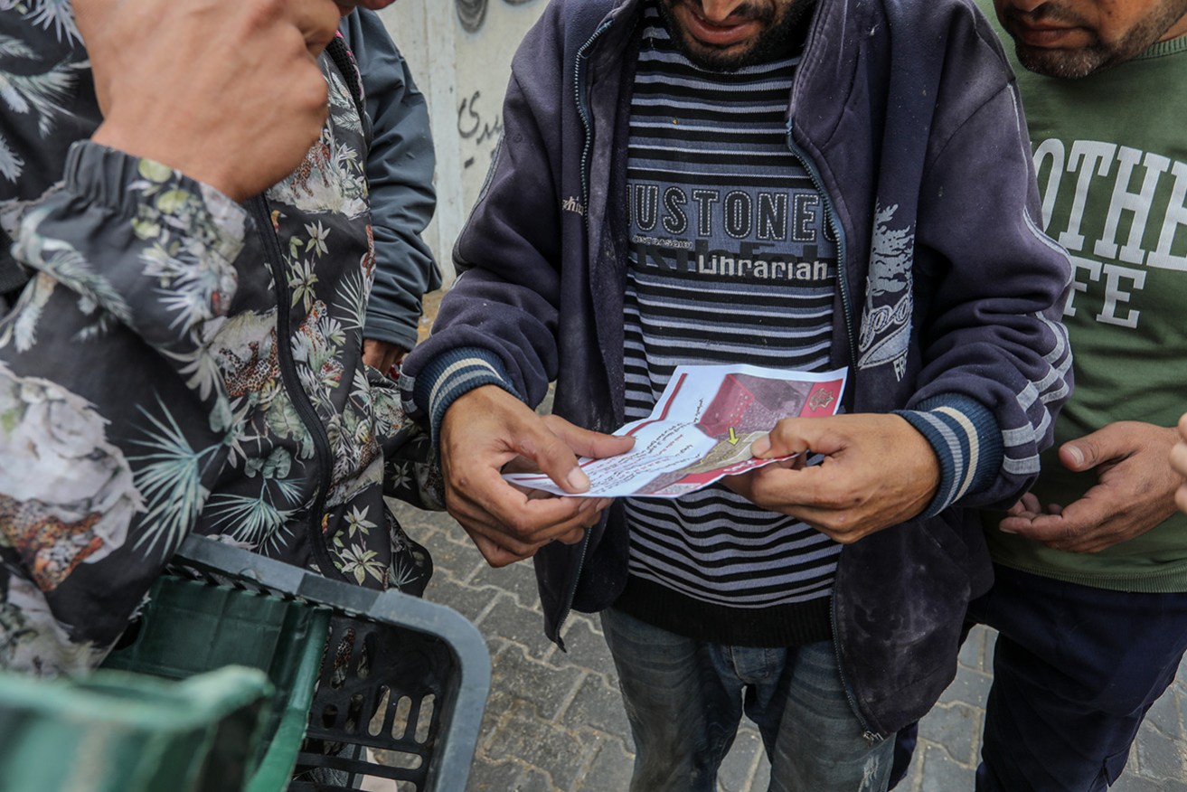 Israeli troops warn Palestinians to evacuate Rafah, with brochures urging them to head west.