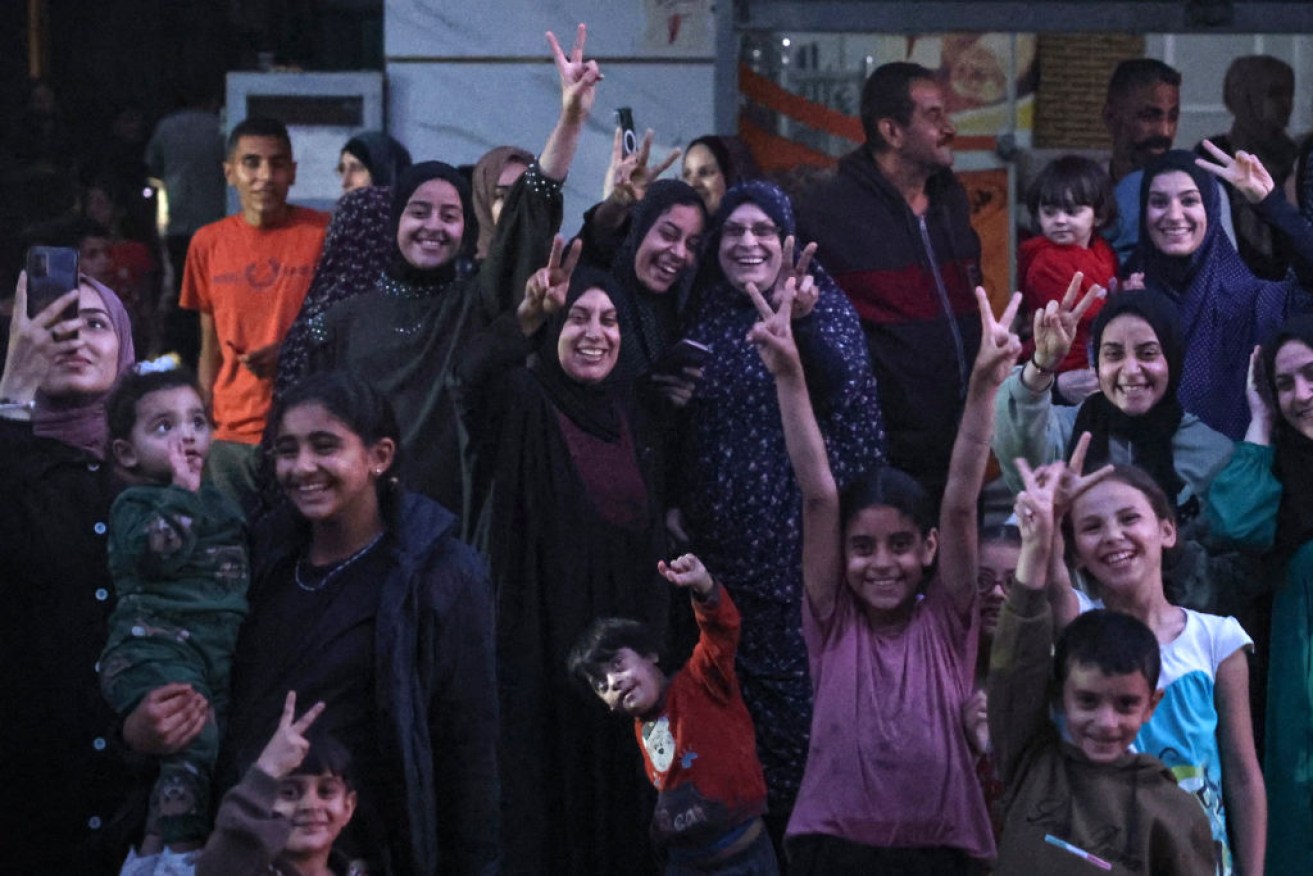 Palestinians celebrate in Rafah after Hamas announced it had accepted a truce.