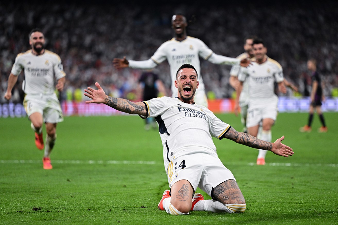 Real Madrid substitute Joselu celebrates his late winner against Bayern Munich at Estadio Santiago Bernabeu on Thursday morning. 