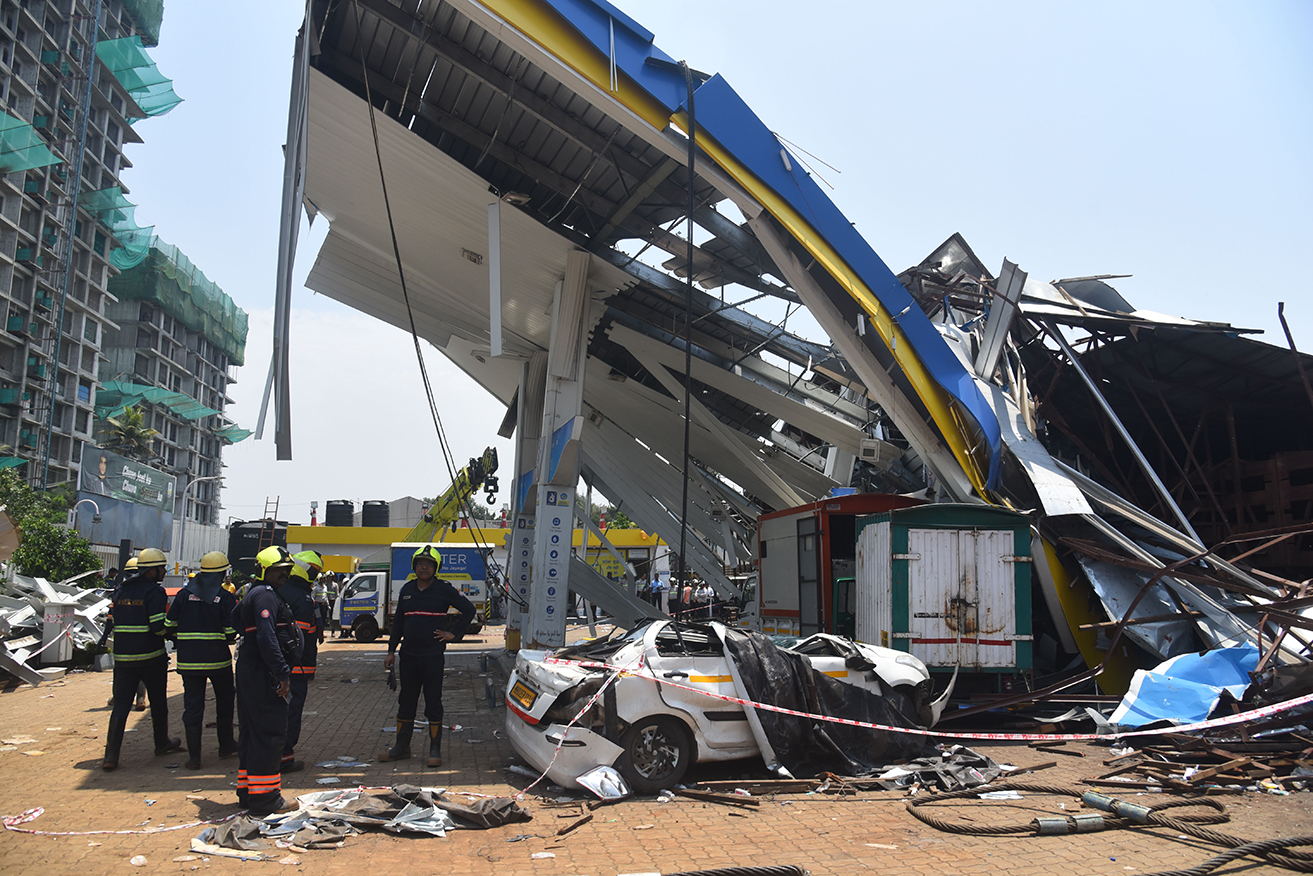 A giant billboard has collapsed, killing at least 14 people while injuring or trapping many more.