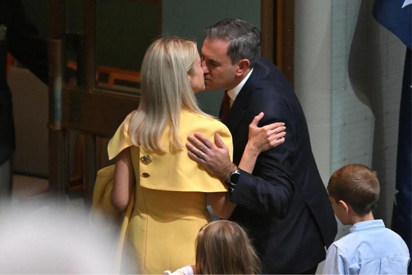 Jim Chalmers and his wife Laura, wearing the dress, on budget night.
