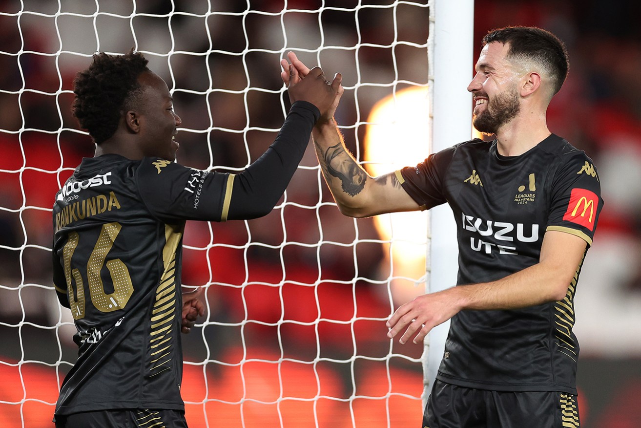 Nestory Irankunda and Apostolos Stamatelopoulos enjoy their winning partnership in Friday night's A-League All Stars victory over Newcastle United in Melbourne.