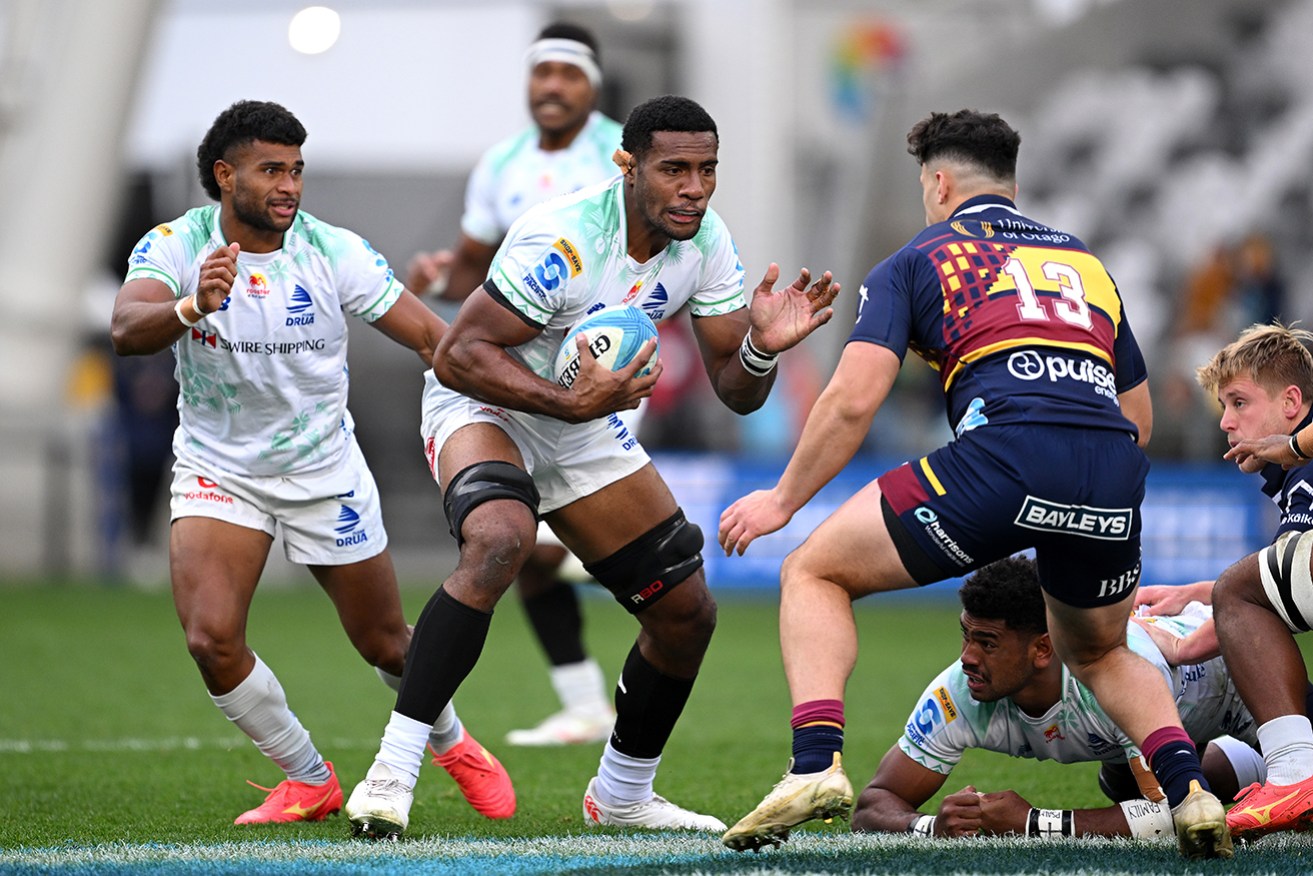 Fijian Drua’s Mesake Vocevoce charges forward against Highlanders in Dunedin, New Zealand.