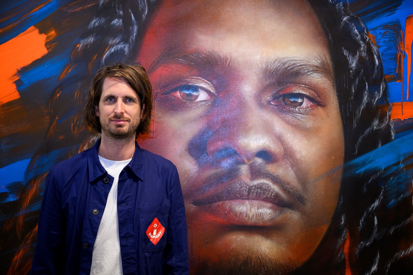 Matt Adnate's portrait of Yolngu rapper Danzal Baker has won the Archibald Packing Room Prize.