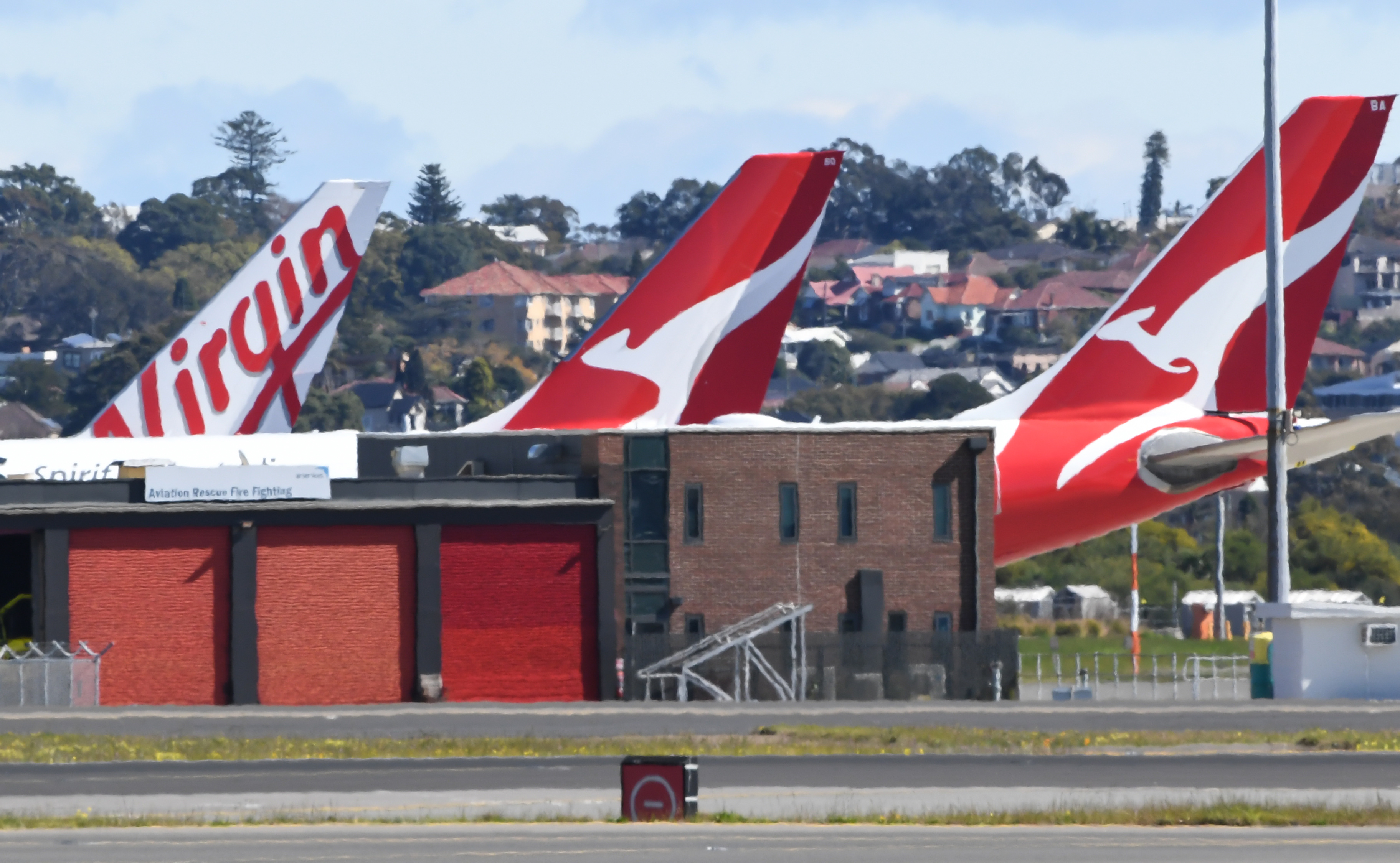 pictured is a Virgin Airlines plane and two Qantas planes
