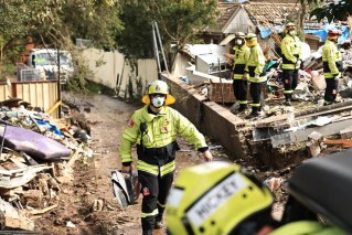 Body found under house collapsed in blast