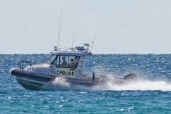 Two women drown after being swept off rocks