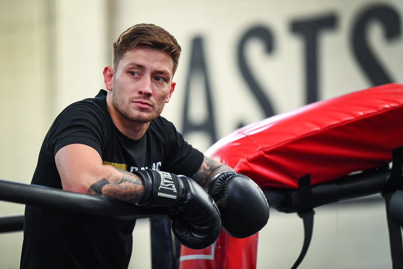 Queensland boxer Liam Paro has caused a huge upset by winning the IBF junior welterweight title.