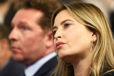 Holly Valance is whispering in the ear of a right-wing politician