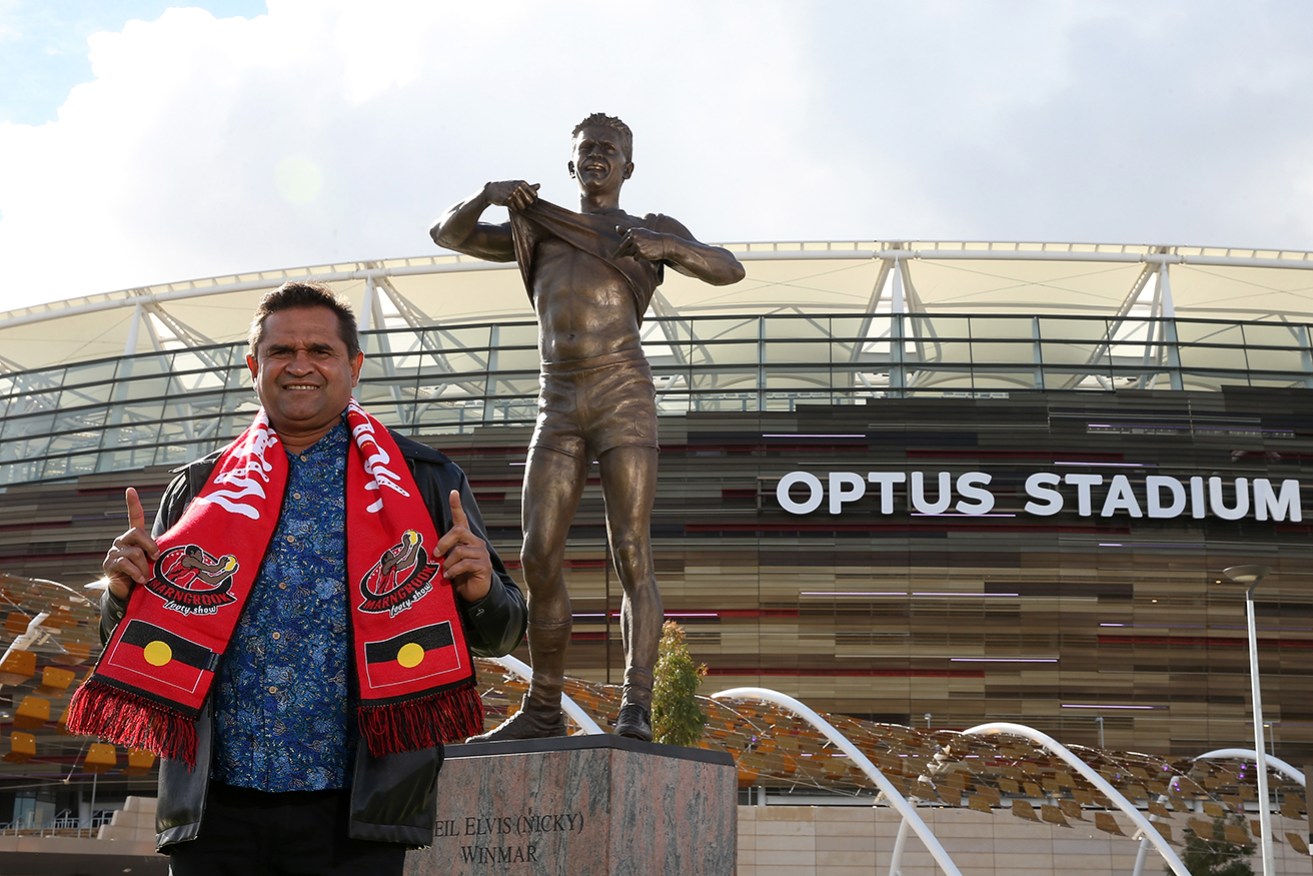 AFL great Nicky Winmar famously called out racism during a game in 1993 by lifting his jersey. 