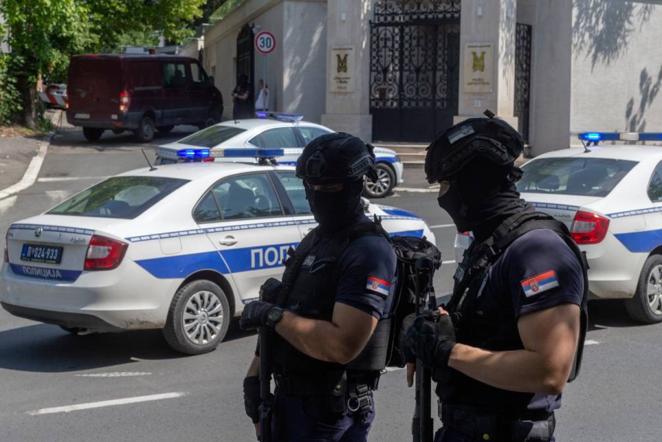 An attacker with a crossbow has wounded a police officer guarding the Israeli embassy in Belgrade.