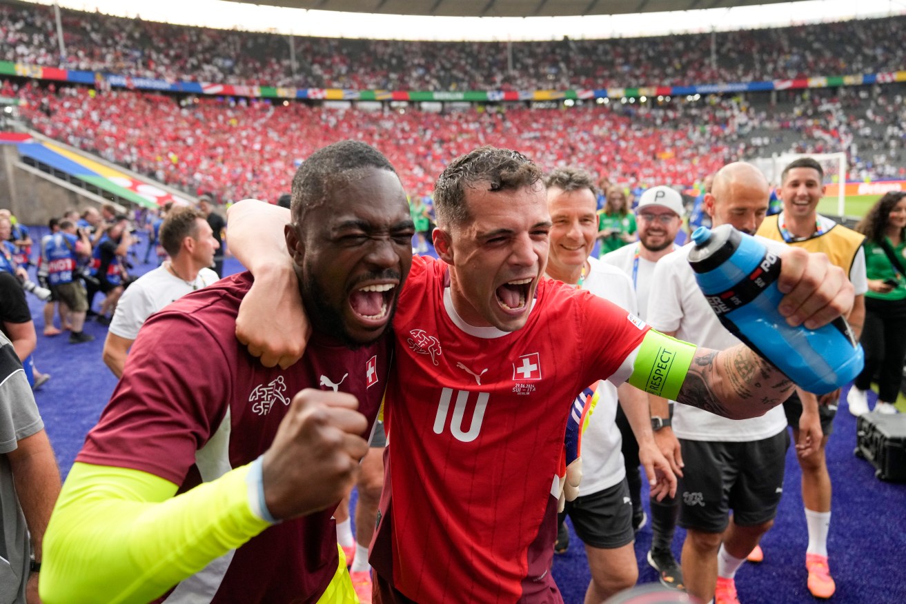 Switzerland players celebrate their round-of-16 triumph against champions Italy at Euro 2024.