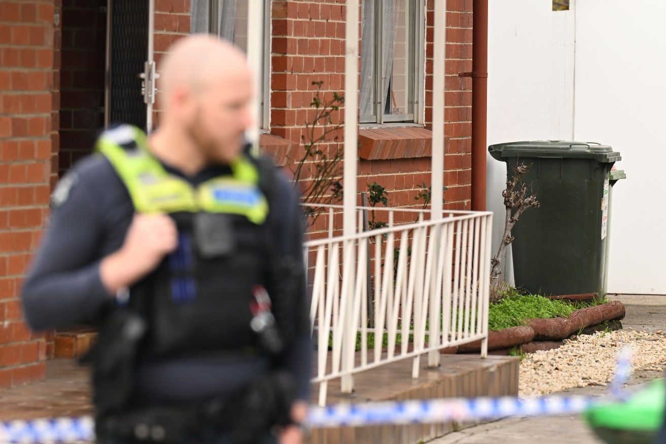 Police search a home in Coolaroo, Melbourne, on Saturday.
