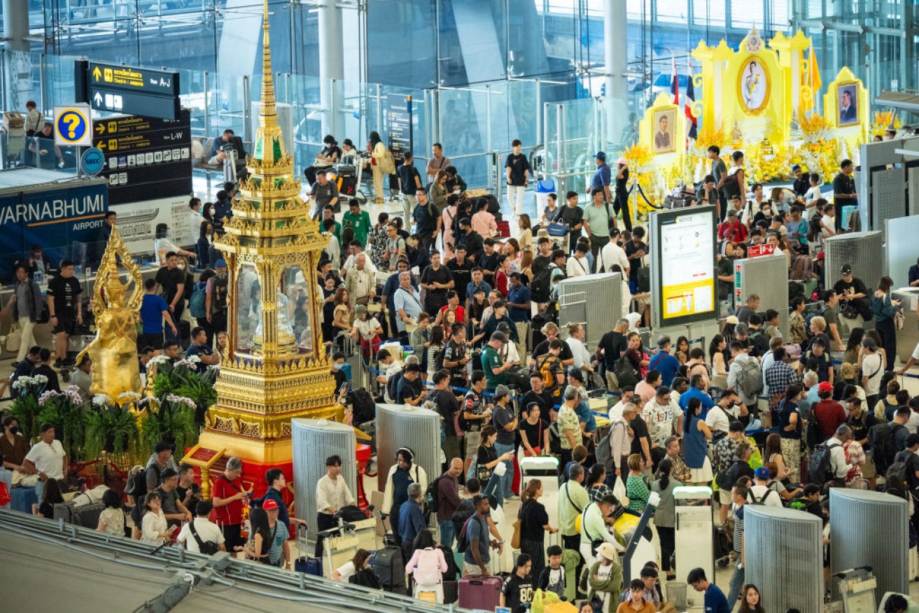 Crowds at Suvarnabhumi Airport in Bangkok after the IT outage.
