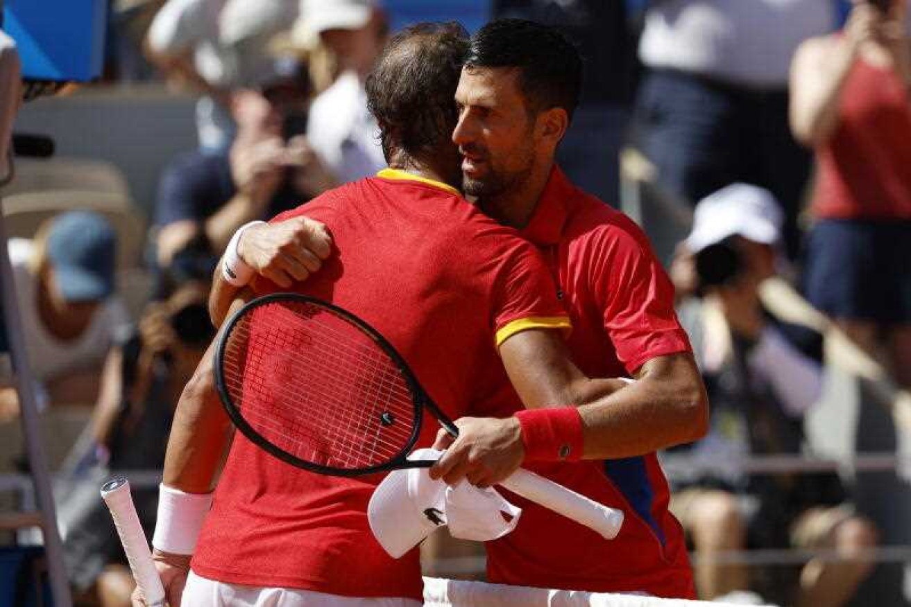 Rafael Nadal congratulates Novak Djokovic after the Serb won their eagerly-awaited Olympic clash.