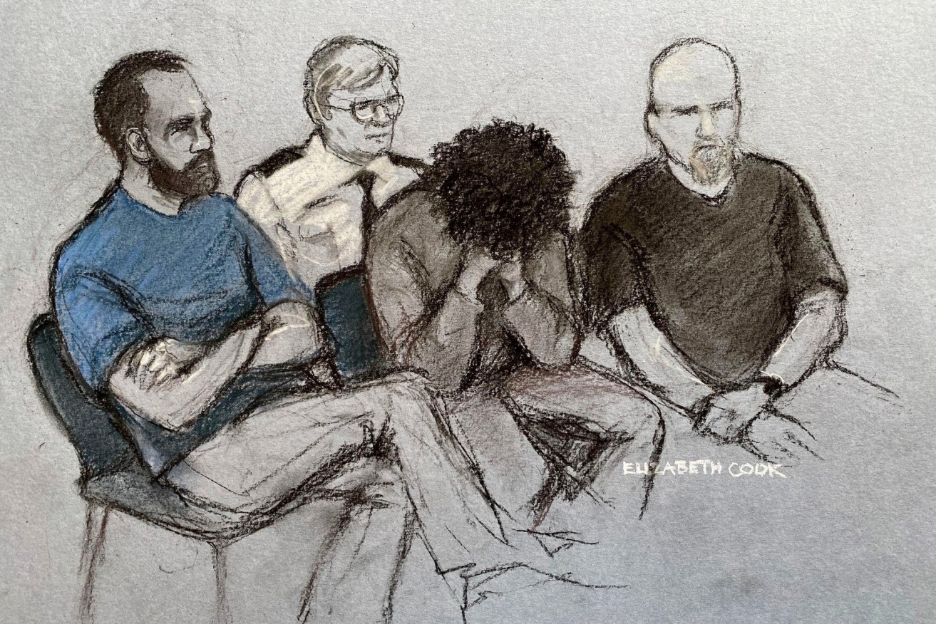 Stabbing suspect Axel Rudakubana covered his face as he sat in the dock at Liverpool Crown Court.