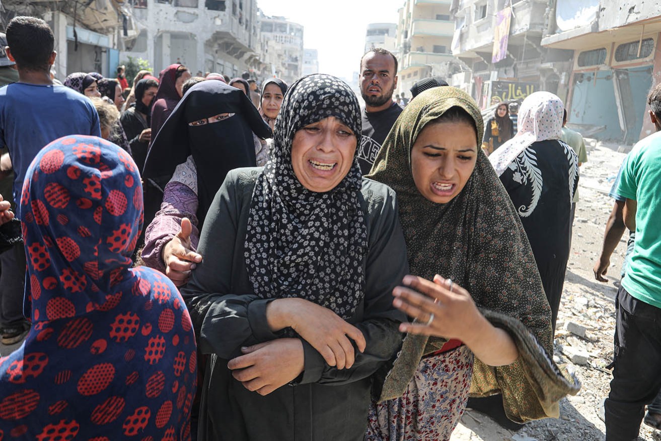 Palestinians flee a deadly Israeli attack in Khan Yunis, Gaza.